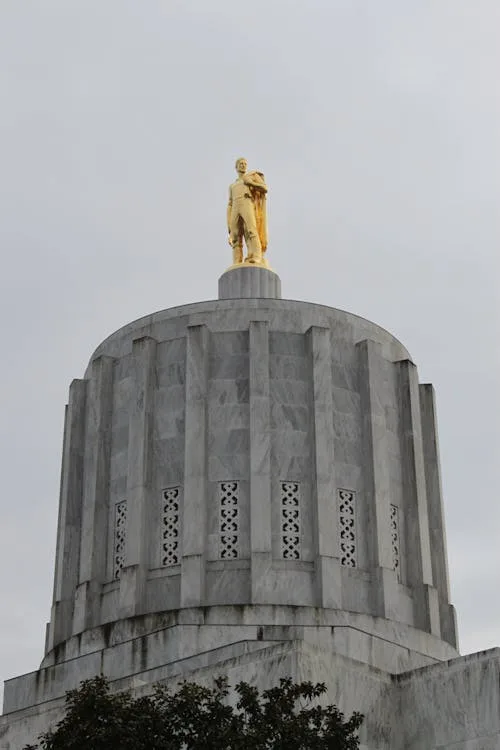 Oregon State Capitol building in Salem with golden pioneer statue on top
