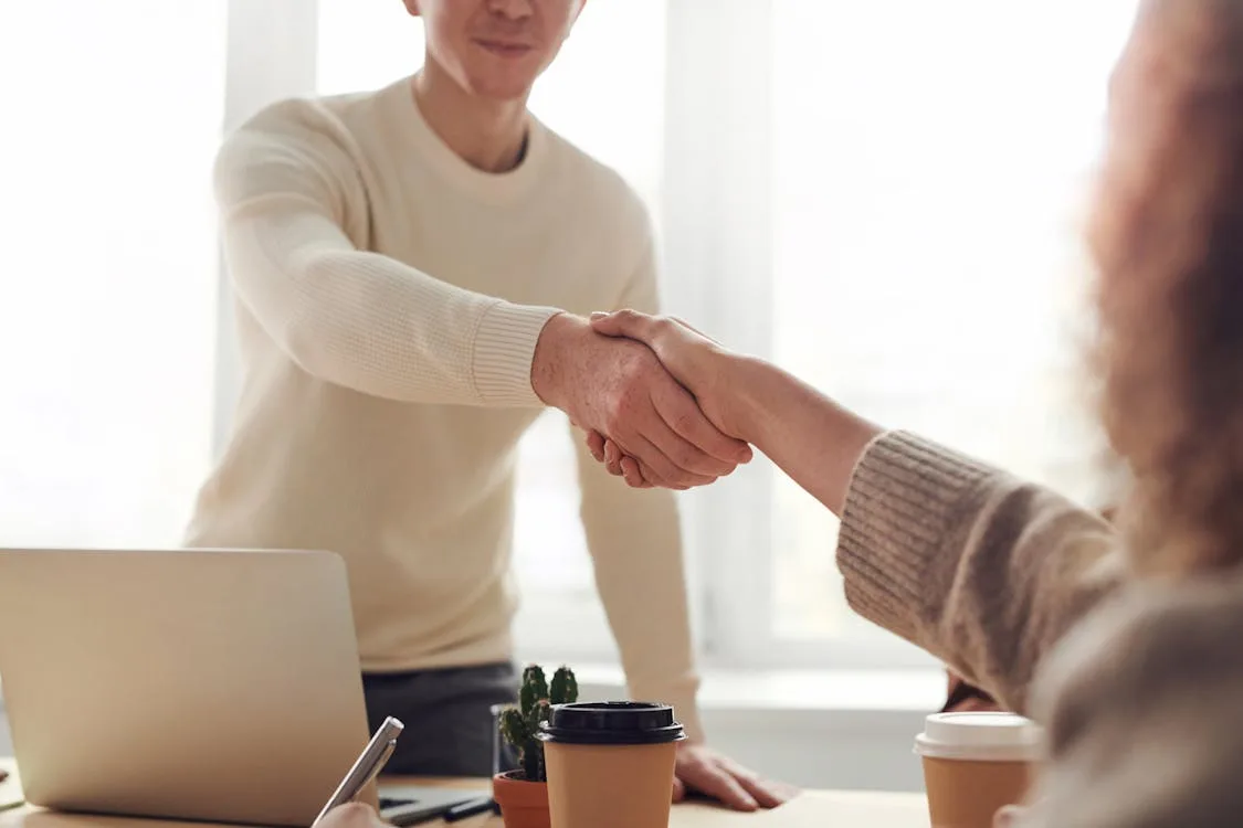 Job interview setting with two people at a table in an office